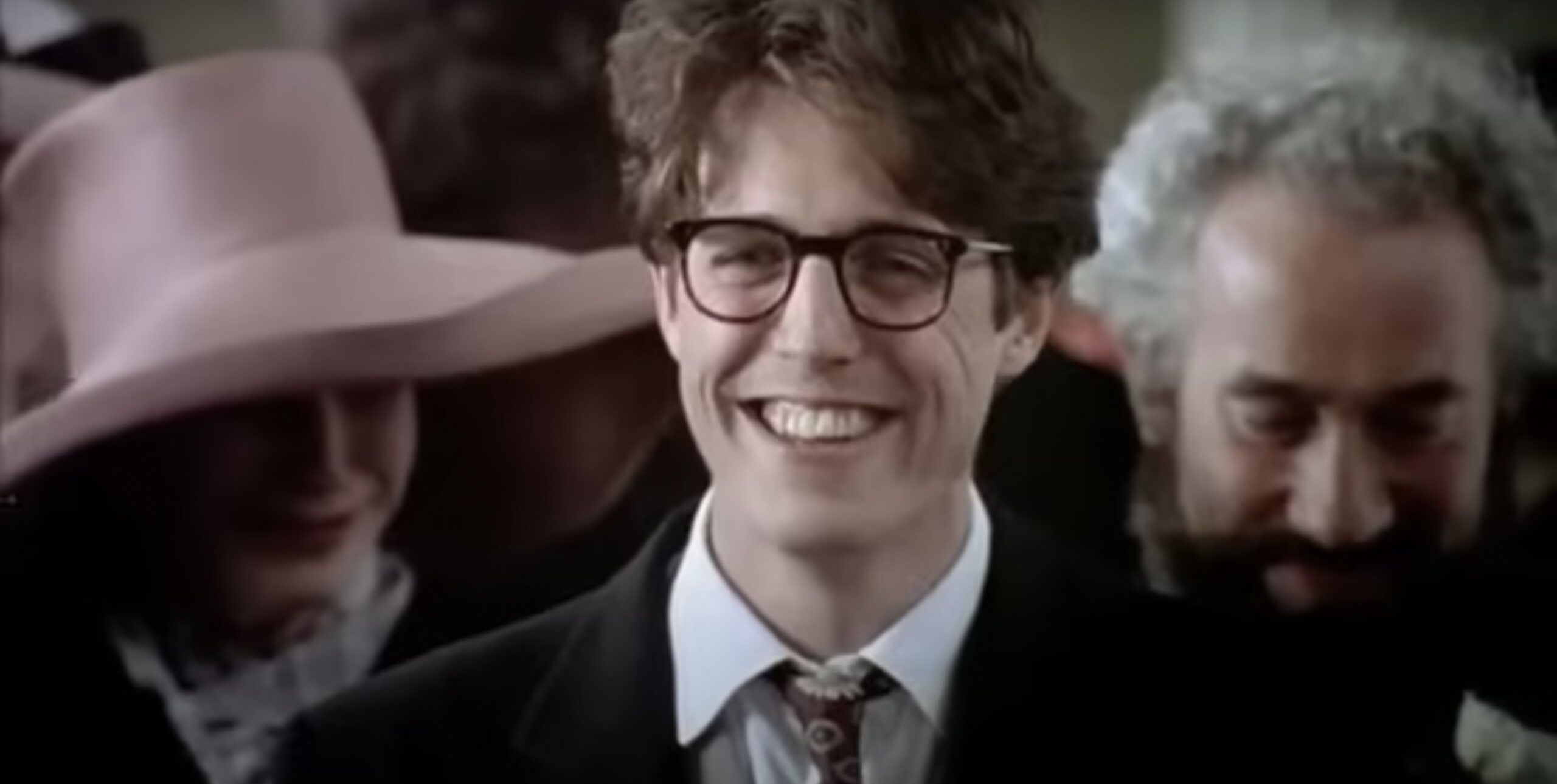 Hugh Grant In Four Weddings And A Funeral, One Of The Best Romantic Comedies Of All Time.