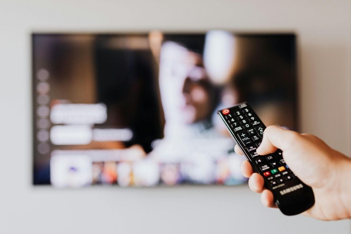 person-with-remote-changing-channel / youtube tv