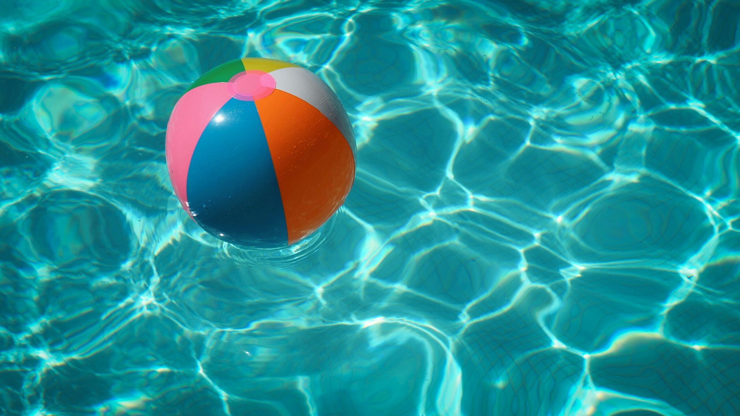 A beach ball in a pool. U