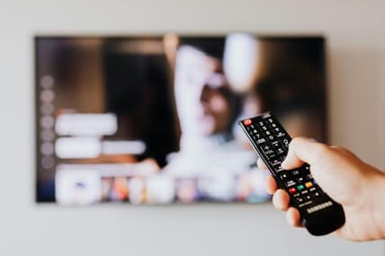 Person-With-Remote-Changing-Channel / Youtube Tv