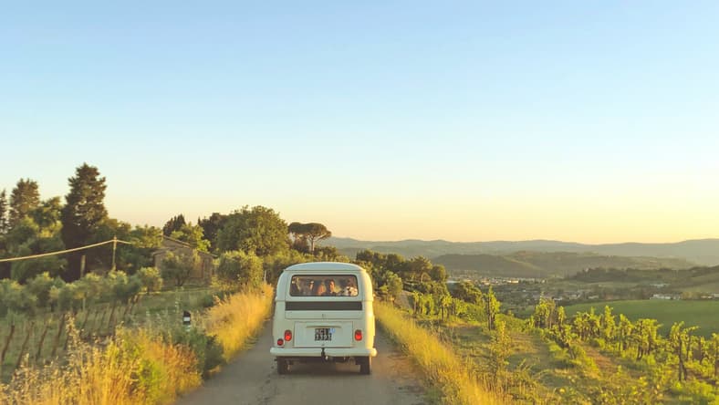 An Image Of A Car On A Road Trip.