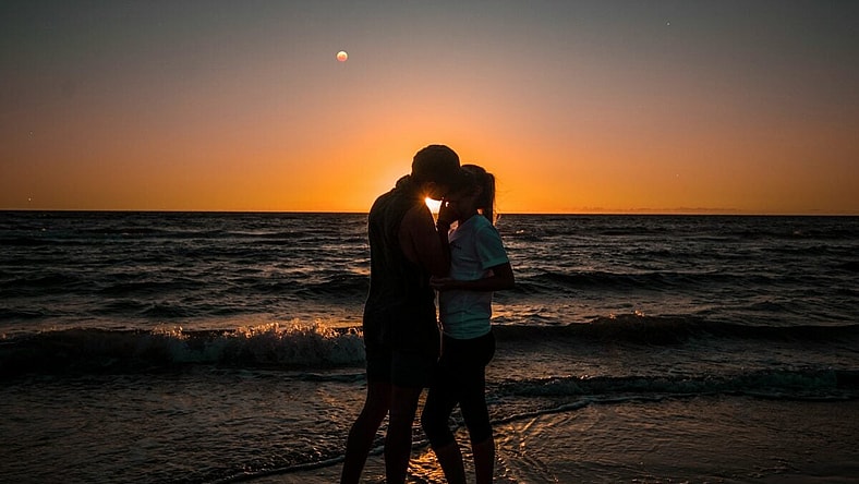Couple Kissing At Sunset / Steamy Romance Movies
